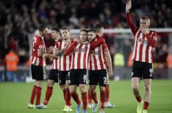 爱游戏-谢菲联客场逼平对手，防守坚固